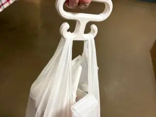 A hook that makes carrying plastic bags more comfortable.