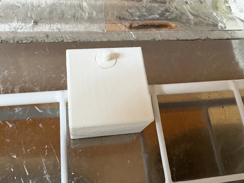 Part for Hooking and Securing a Mesh Rack