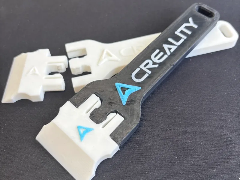Scraper with interchangeable blade