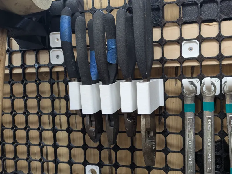 Opengrid plier slot holder