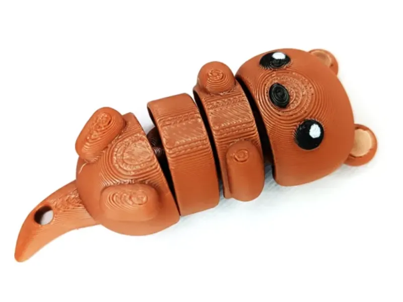 Lontra flexível fofa (chaveiro e ímã)