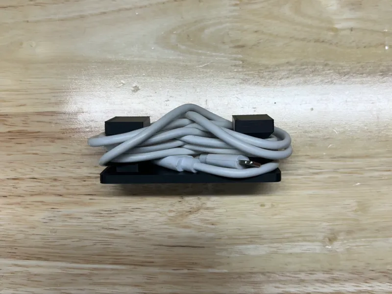 Charger cable holder/cable cleat