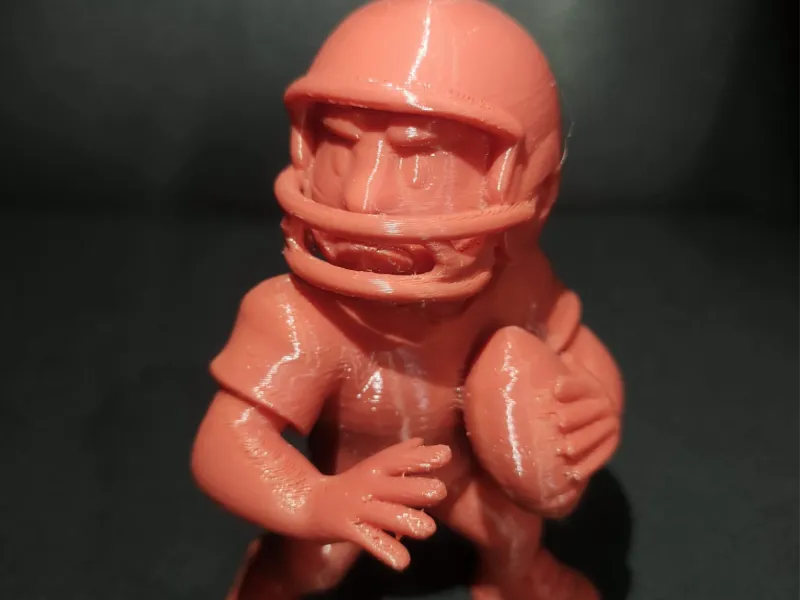 American Football Player with Helmet And Ball Figurine