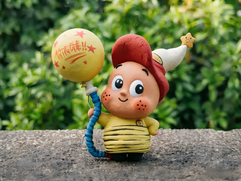 Electric bulb & star kid figurine