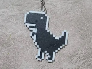 llavero dinosaurio pixelado