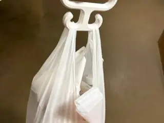A hook that makes carrying plastic bags more comfortable.