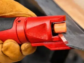 lawnmower blade shaper attachement for rotary tool