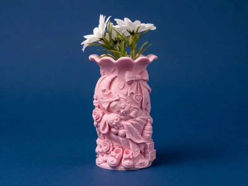 Decoratively detailed pink vase with 3d relief design