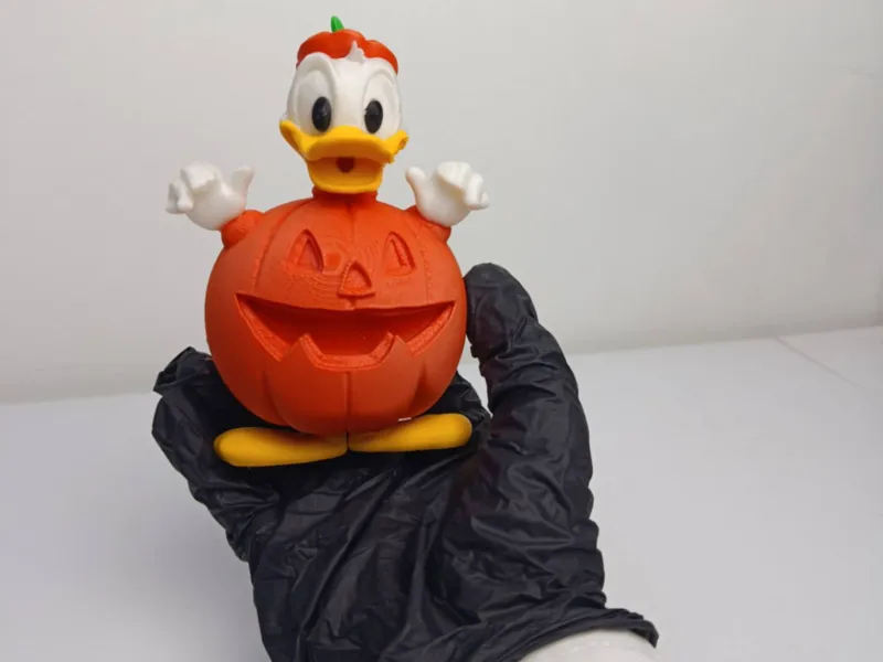 Donald Duck wears a multi-piece, multi-colored pumpkin costu