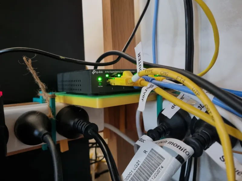 Under desk shelf for 8 port network switch
