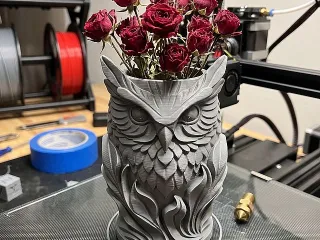 Owl vase of flowers