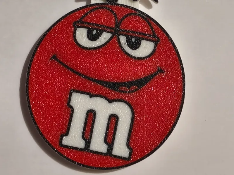 Abridor de garrafas em formato de m&m