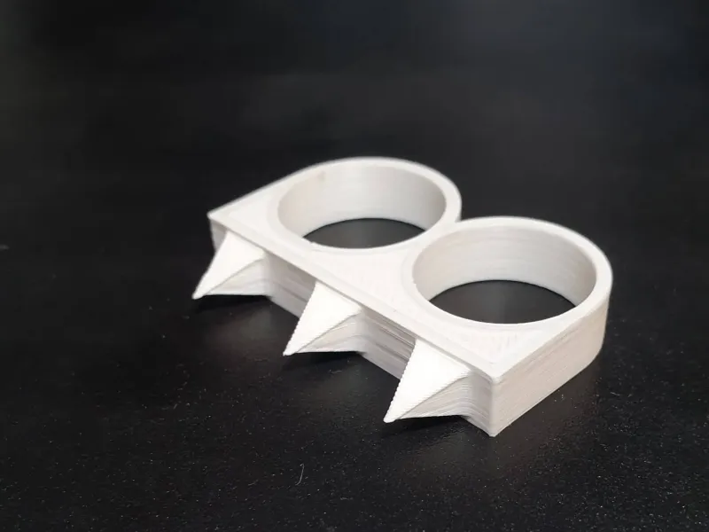 Anillo doble para autodefensa
