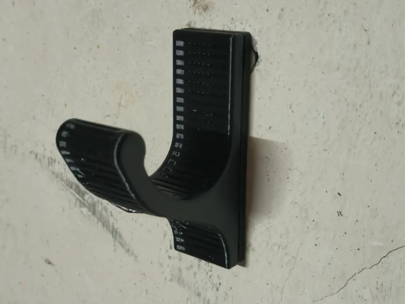 Wall-mounted helmet hook – two-piece mounting system