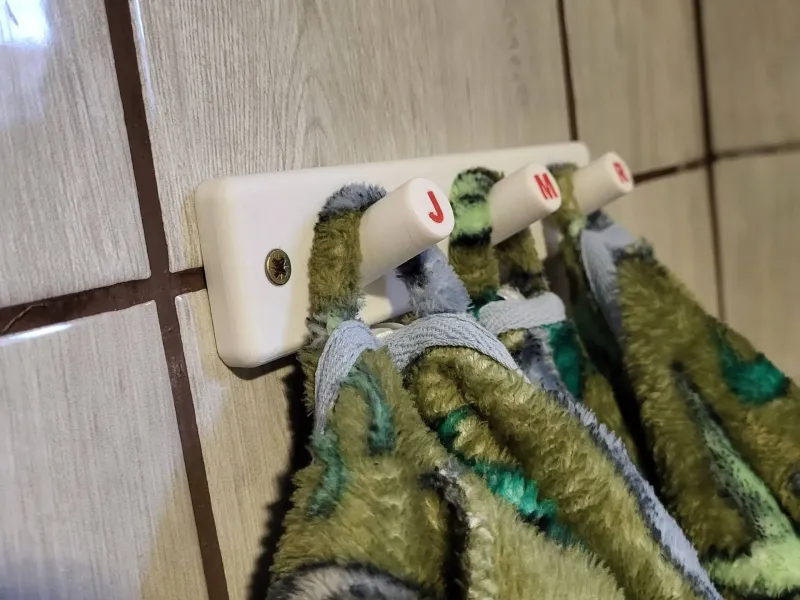 Triple bathrobe wall hanger
