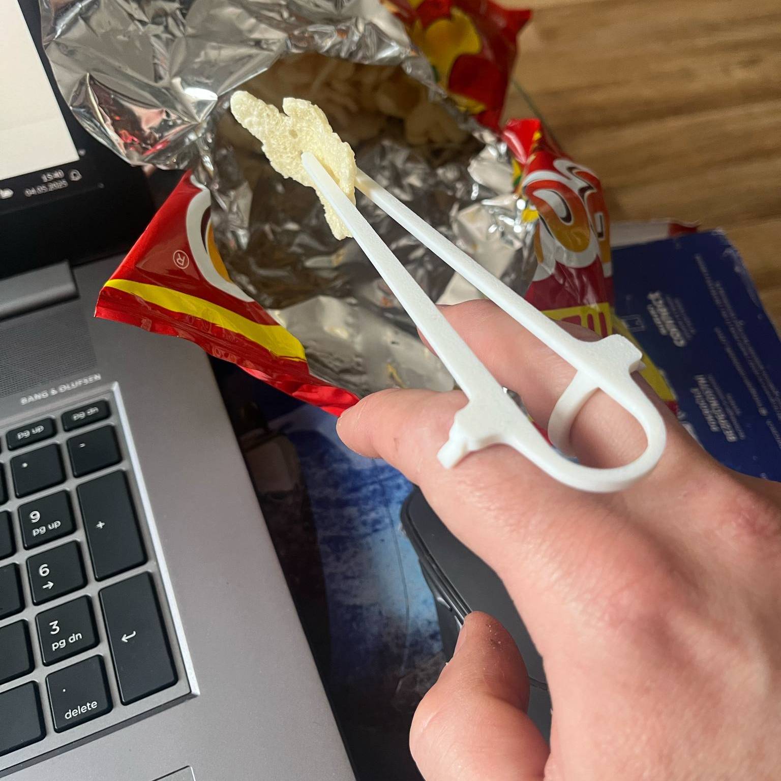 A device for eating chips, nachos, chopsticks for eating