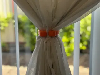 Curtain ring tieback
