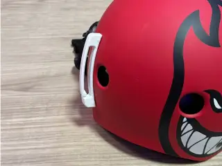 Helmet goggle strap clip