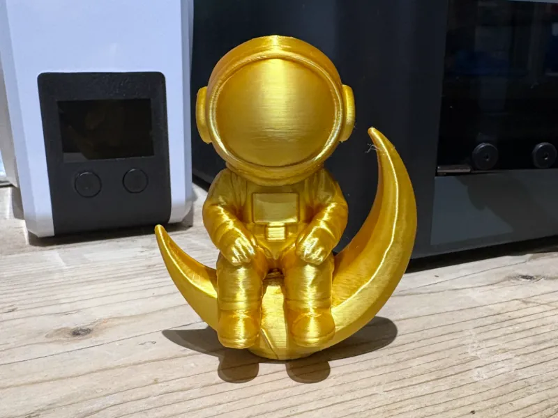 spaceman sat on moon