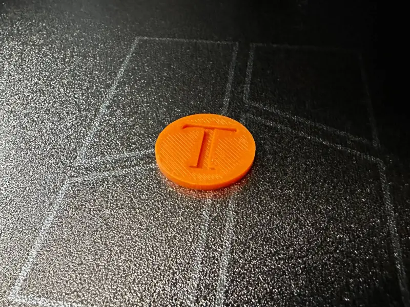 Einkaufswagenchip mit dem Buchstaben "T"
