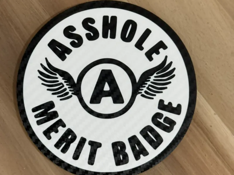 Asshole merit badge with holder