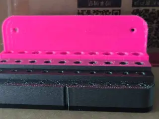 Wall-mounted drill bit holder