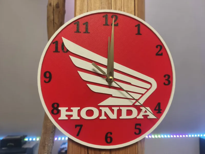 Wall clock with Honda motif