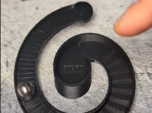 Espiral ascendente: la canica que rueda HACIA ARRIBA hasta el centro (opti