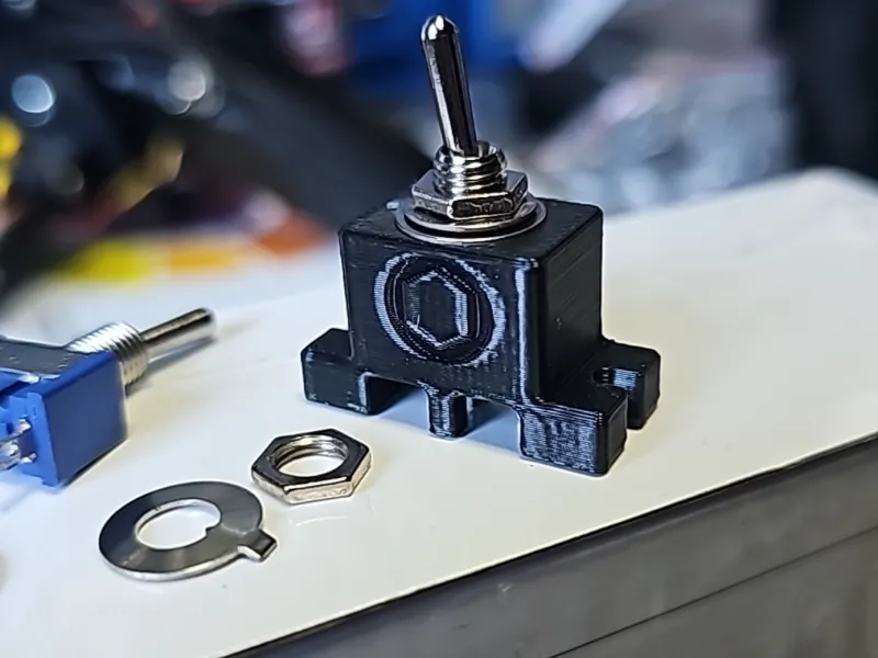 Screw on cover for 6 amp 125 VAC toggle switch.