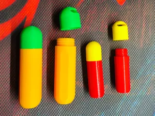 Capsule-shaped container in two sizes.