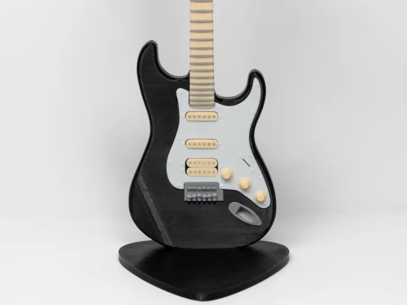 Soporte para auriculares con forma de guitarra