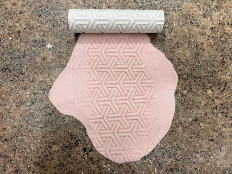Rouleau à motif entrelacé