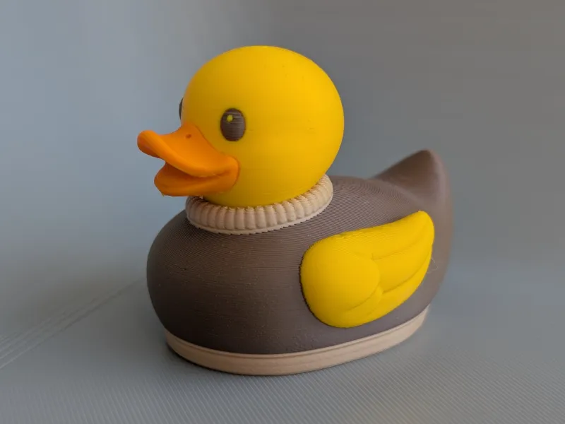 Sweater Duck – Cozy Rubber Ducky Figurine