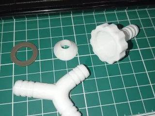 Faucet fitting with a tee