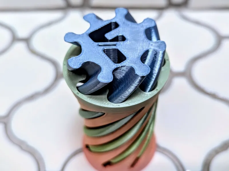 Juguete Fidget Vórtice Espiral con Letra F Perforada de 180 Grados
