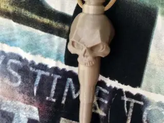Bullet pendant with skull