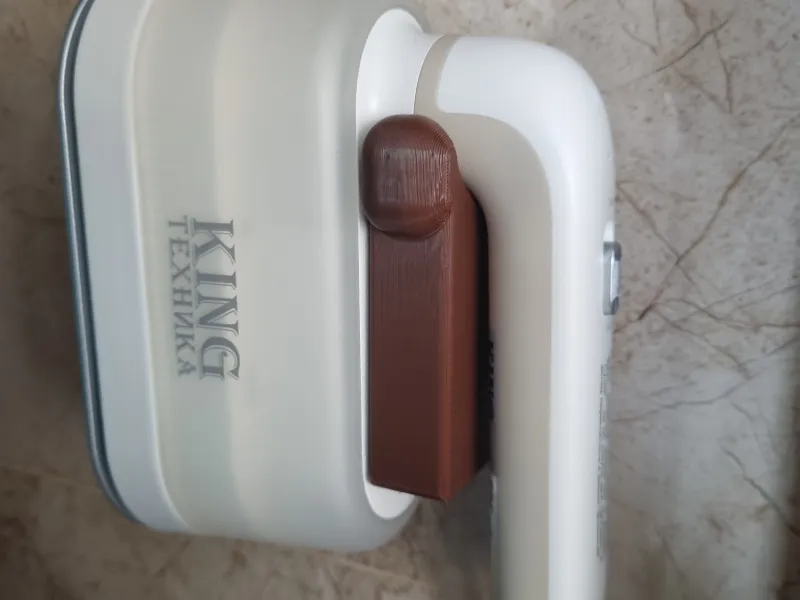 Wall-mounted holder for hand-held steamer